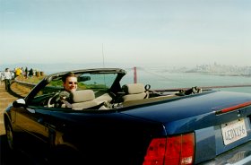 Lindsay in the mustang overlooking Golden Gate Bridge